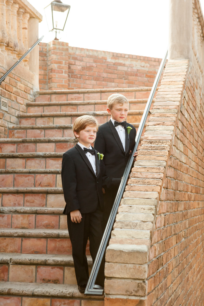 Lush Tuscan-Inspired Wedding Ring bearers standing on stairs
