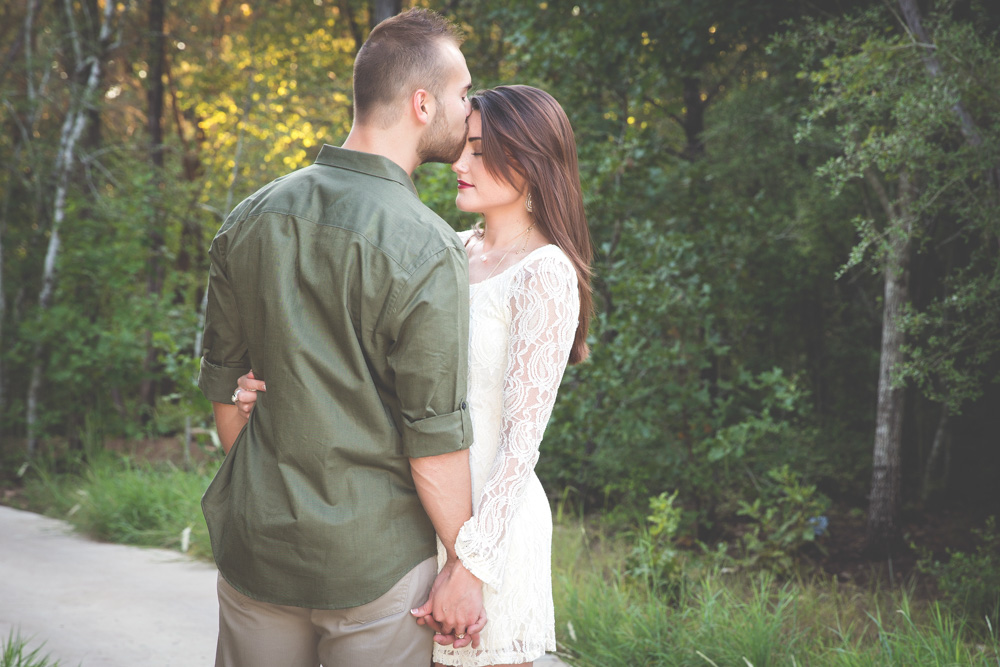  Intimate Texas Hill Country Engagements couple holding eachother in woods