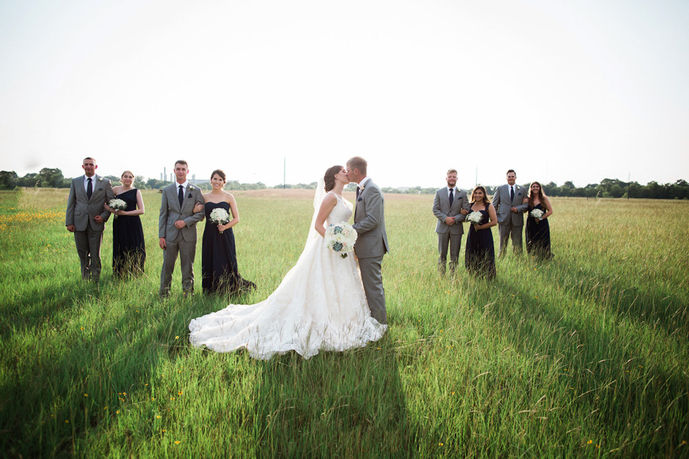 Southern Elegance at Beckendorff Farms bride and groom and wedding party in field