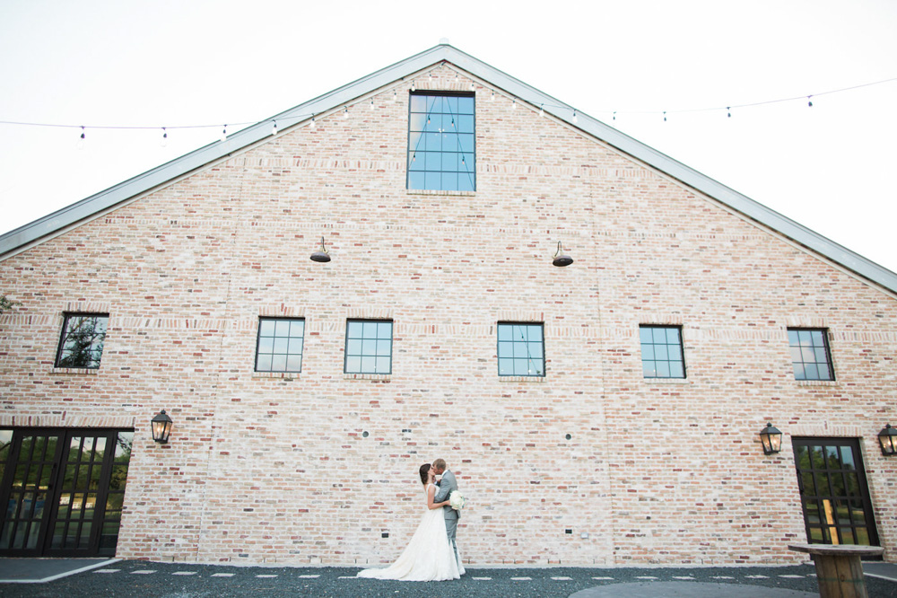 Southern Elegance at Beckendorff Farms bride and groom in front building