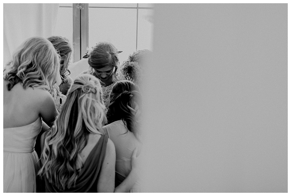 First Wedding at The Farmhouse bridesmaids praying for bride