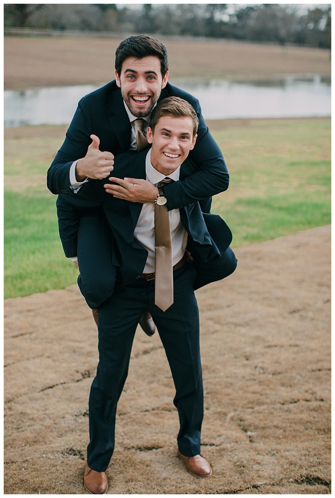 First Wedding at The Farmhouse groom and best man piggy back